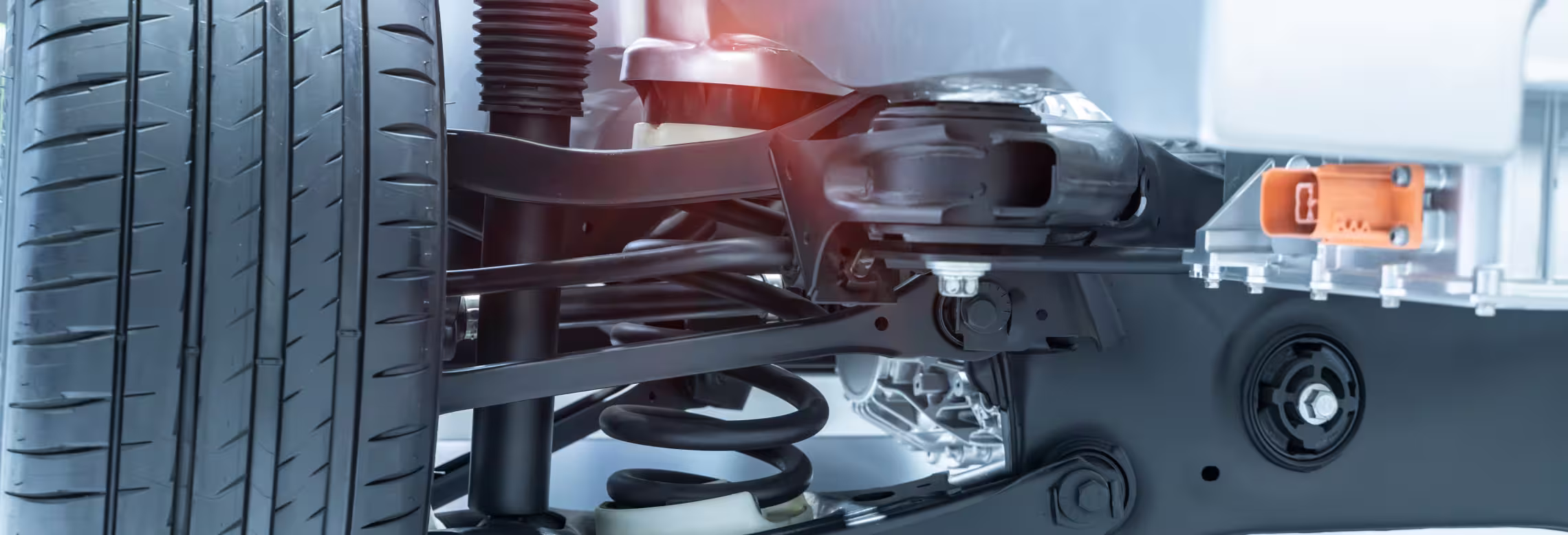 Image depicting the front suspension system of a car, showcasing its components and structural design.