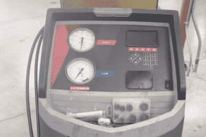Summer Car AC Service Ensure Reliable Cooling for Milwaukee Heat - Next Level Auto Services - A close up shot of an automotive A/C service machine